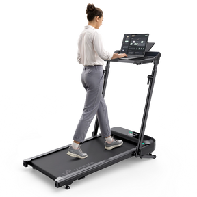 A woman walks on the FoldiMix 5L Smart Treadmill, using its built-in tablet interface.
