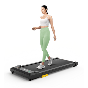 A woman walks on the UREVO SpaceWalk E1L Treadmill, showcasing its compact and efficient design for home workouts.